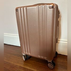Calpak Rose Gold Carryon Luggage